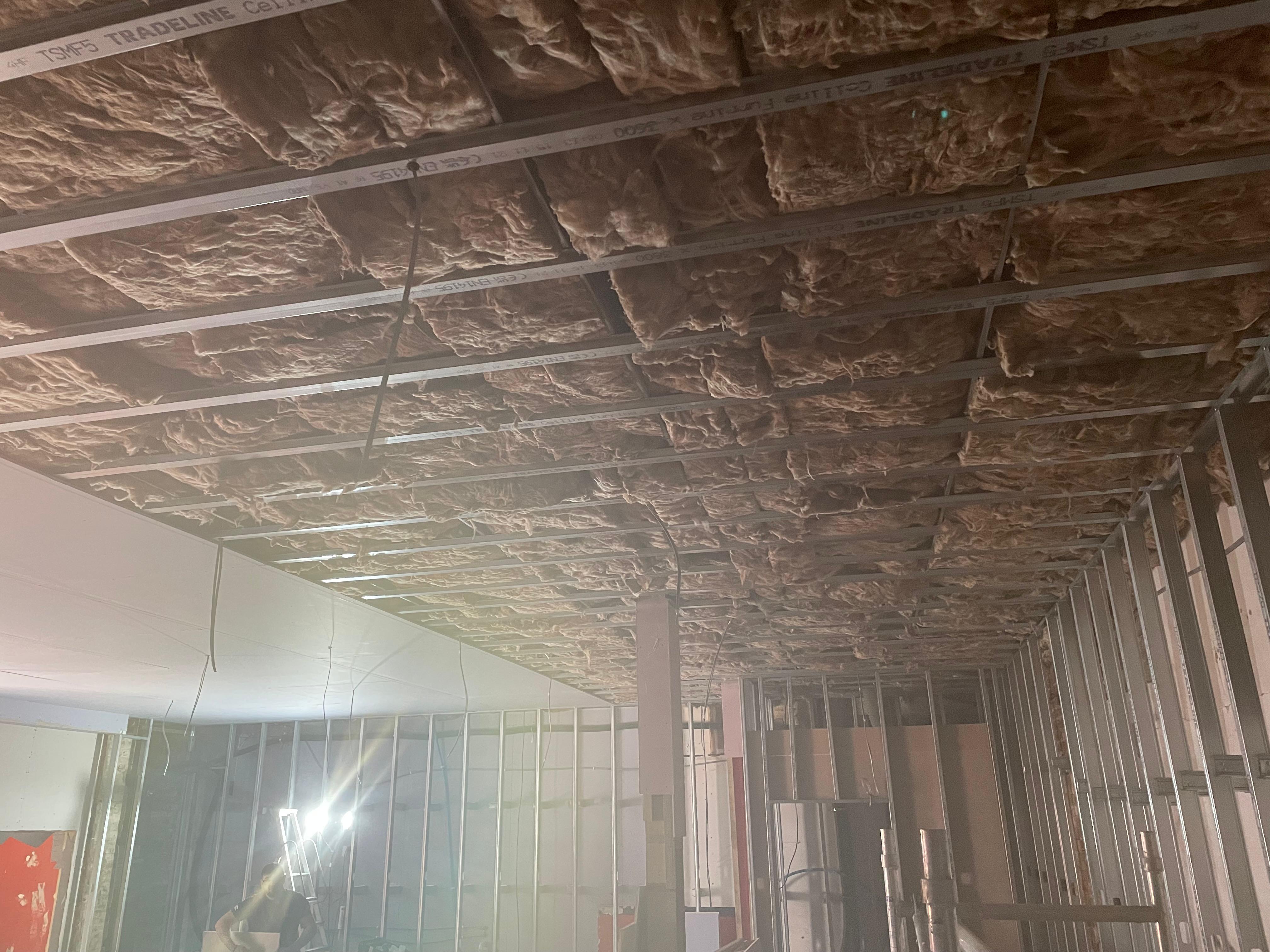 MF ceiling with fibreglass insulation installation